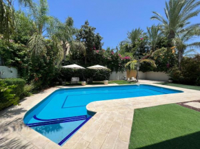 Elegant 5BR Haven with Sparkling Pool Serene Garden Oasis